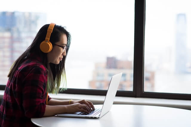 Woman wearing ANC headphones