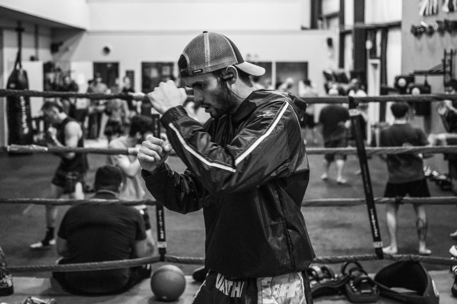 Man working out with ip-rated wireless earbuds