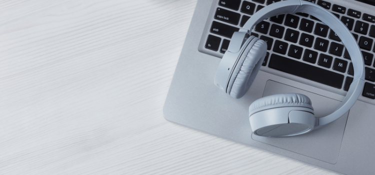 grey headphones on laptop