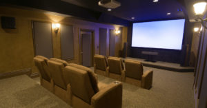 Home theater speakers with projection screen