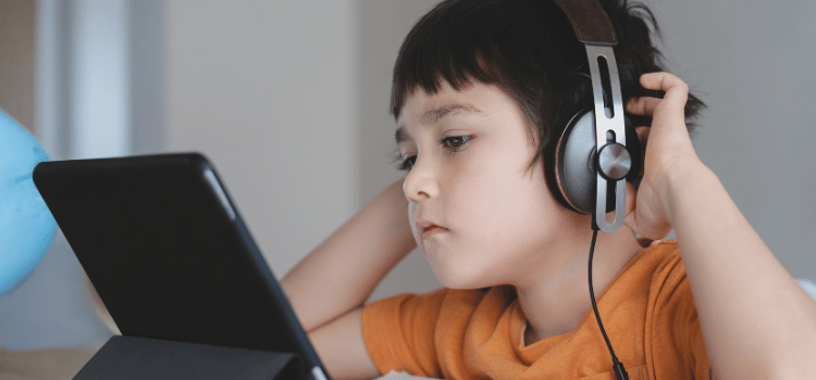 Kids listening to tablet with headphones