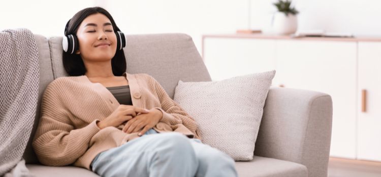 Woman relaxing with headphones on